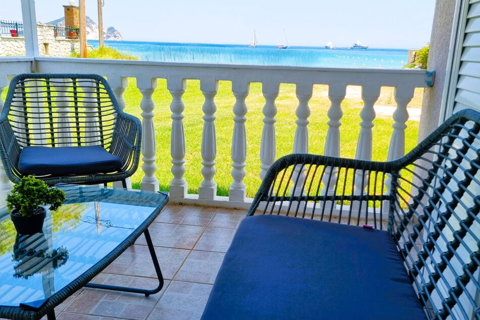 Marathon-Studios-Room-8-bacony-view-beach-from-table-and-sofa